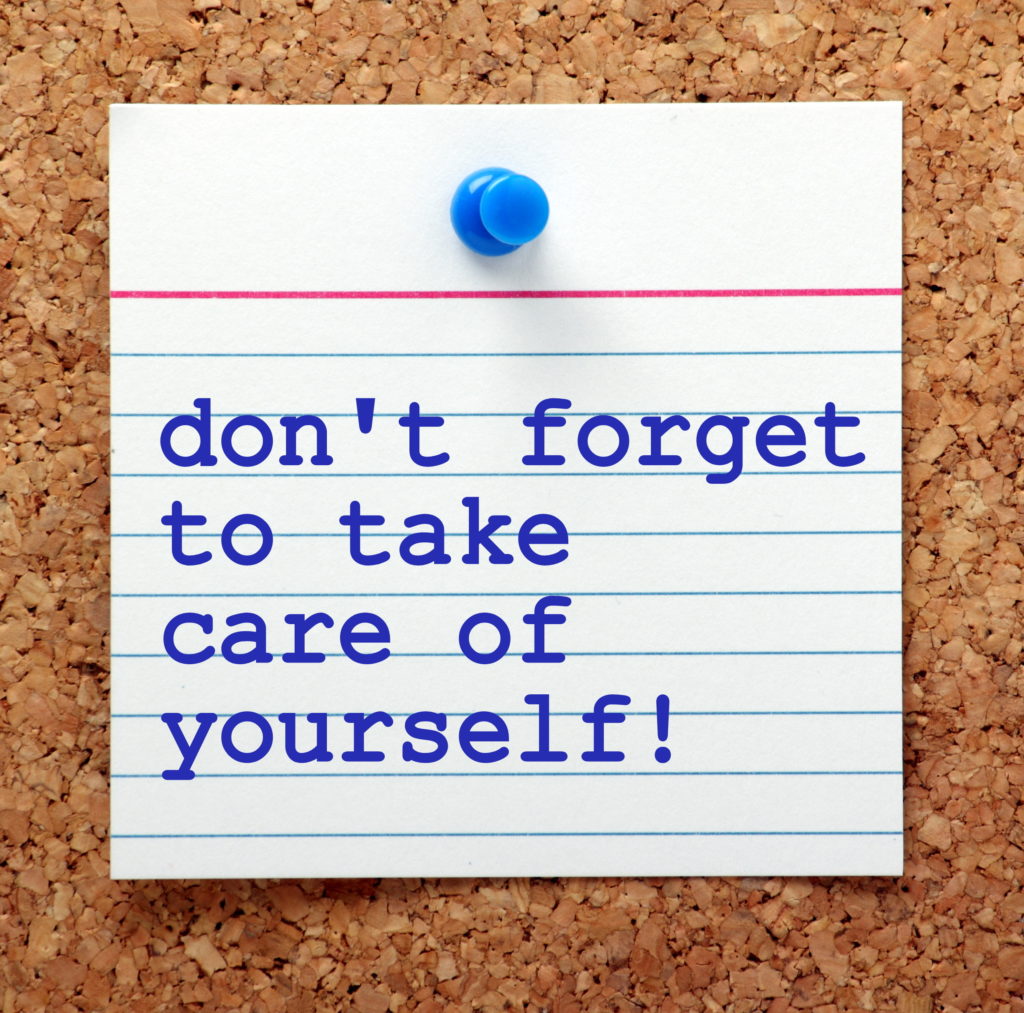 note card with words don't forget to take care of yourself. 